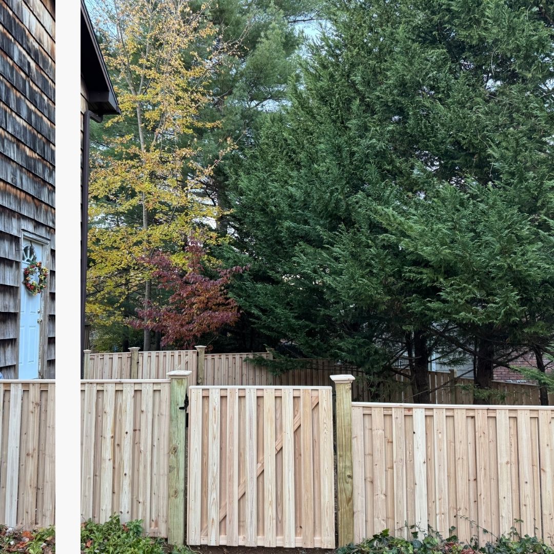 New vertical wood privacy fence and matching gate installed by replacement fence installers