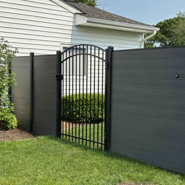 a composite fence with a gate