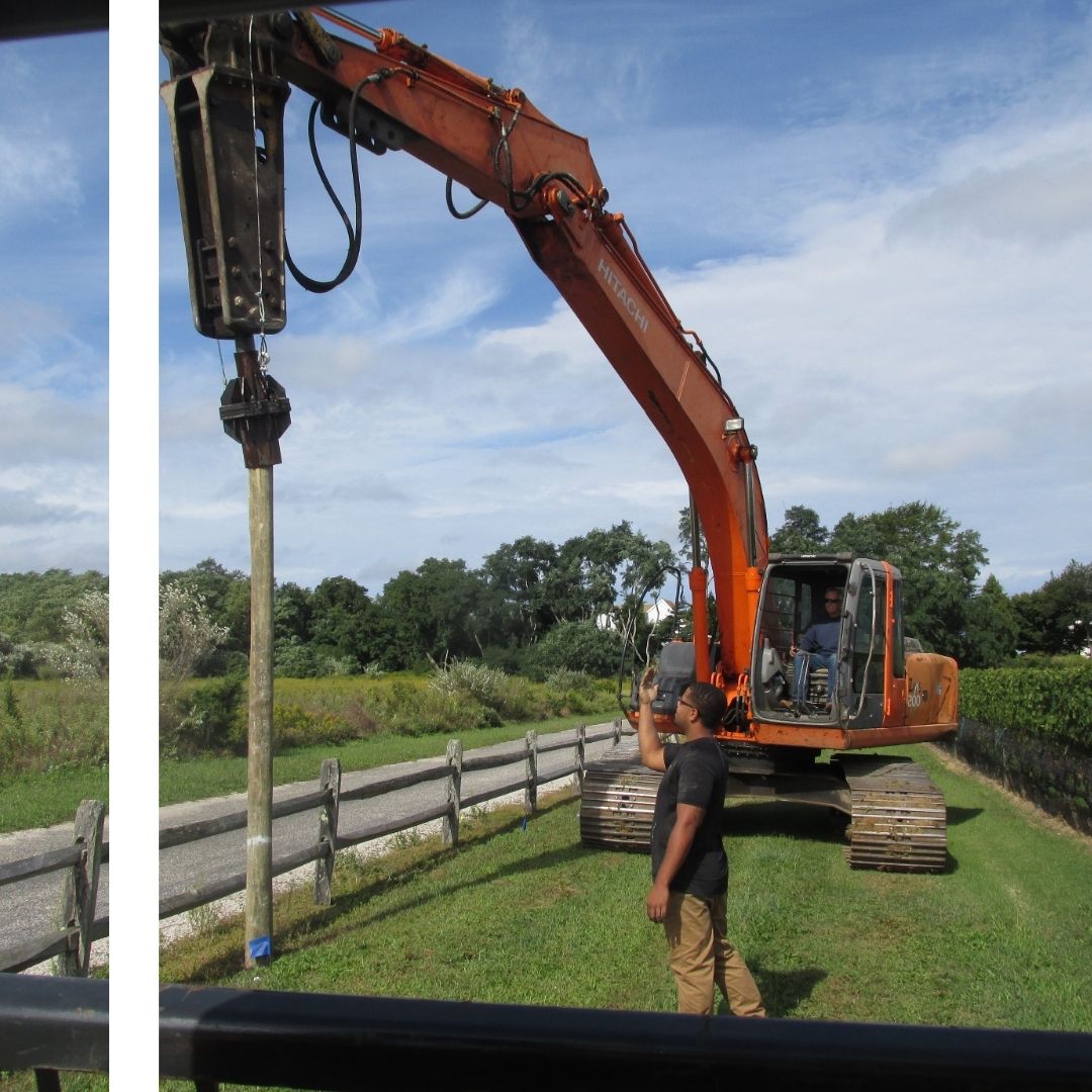 large machine working on commercial fence