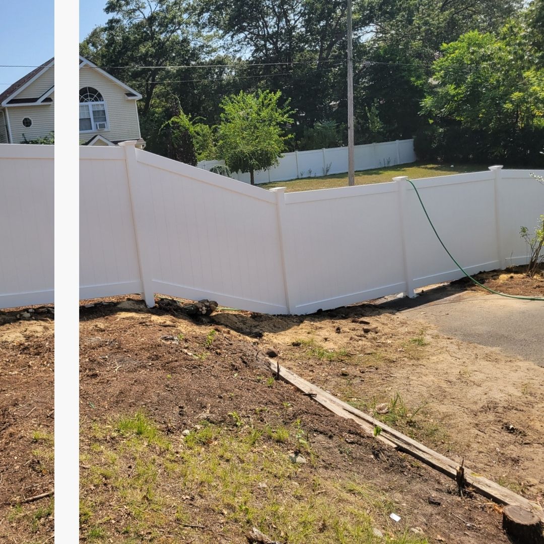 Expertly installed white vinyl privacy fence following the grade of a sloped property in Sheepshead Bay.