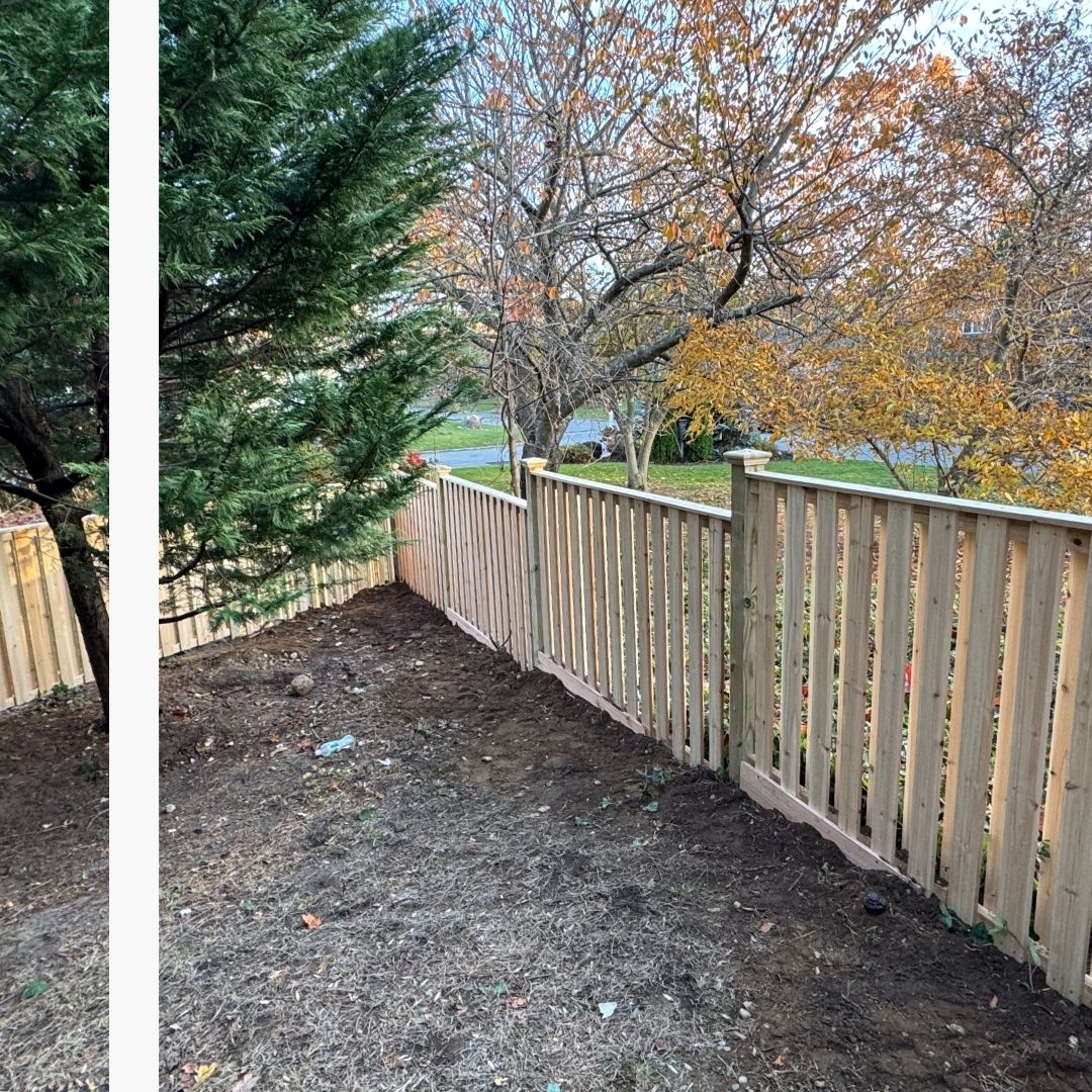 High-quality wood picket privacy fence installation bordering a residential treeline in Sheepshead Bay, New York.