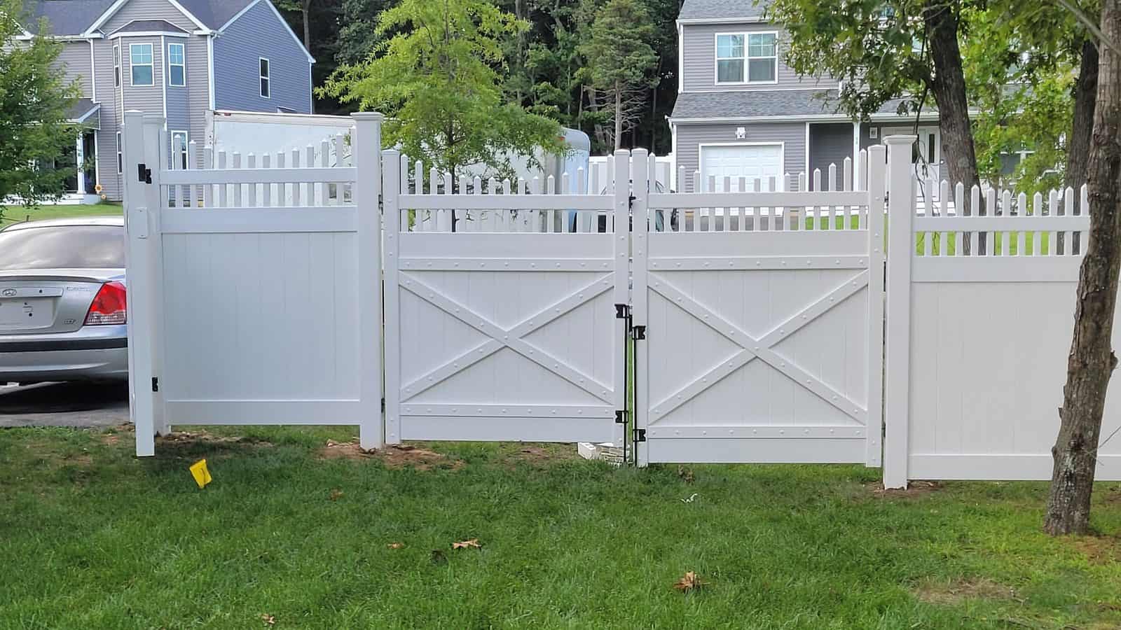 News And Events 13 White PVC privacy fence with a picket top and double drive gate at a Long Island home